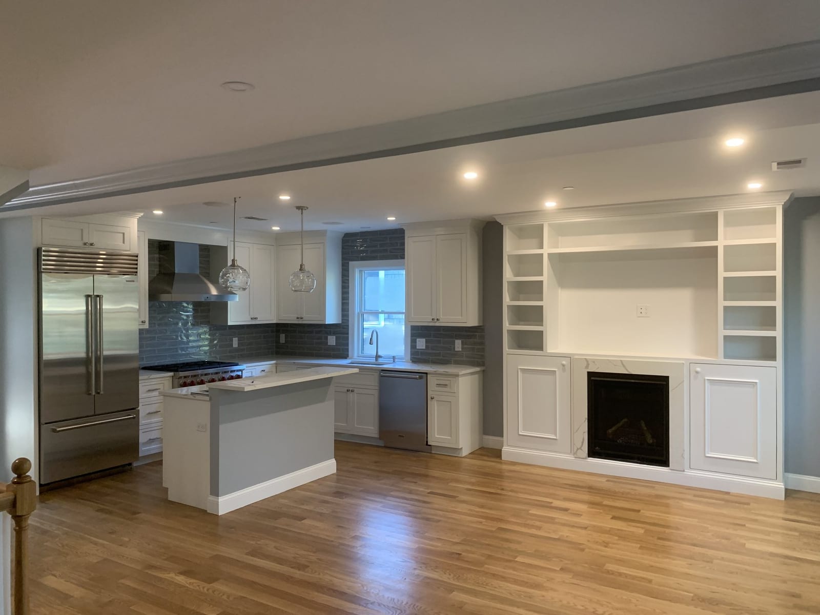 Open-concept kitchen with island and built-in cabinetry